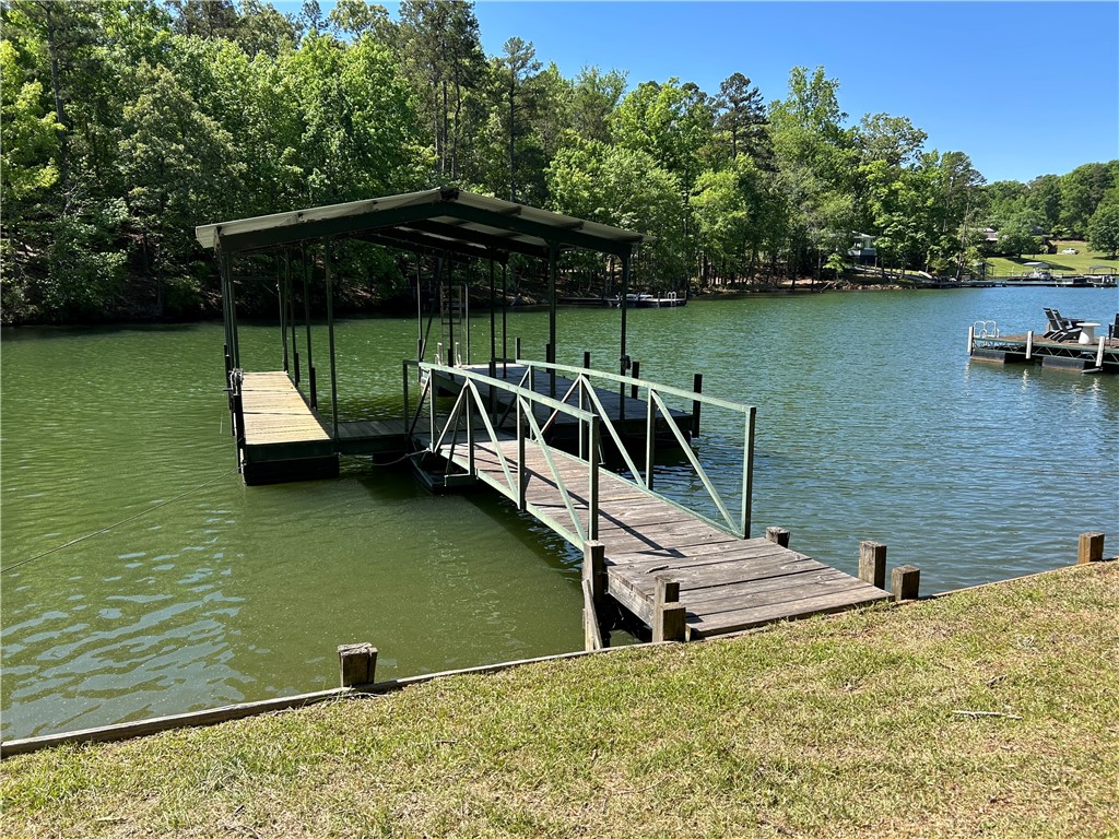 43 Sunset Cove Road Abbeville, SC 29620 - Photo 30 of 41 This tranquil waterfront retreat features a private dock, offering direct access to serene waters and lush surroundings.