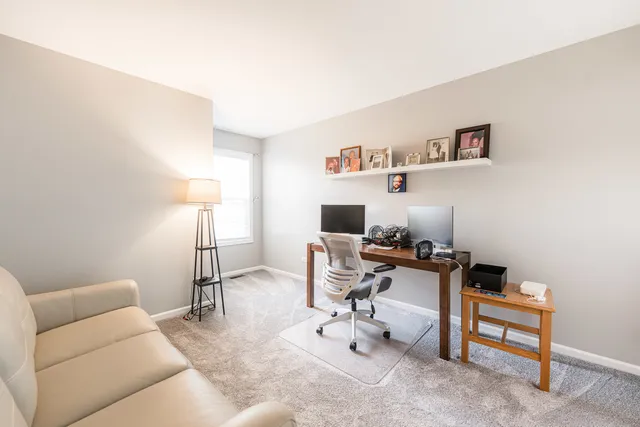 a view of a workspace with furniture