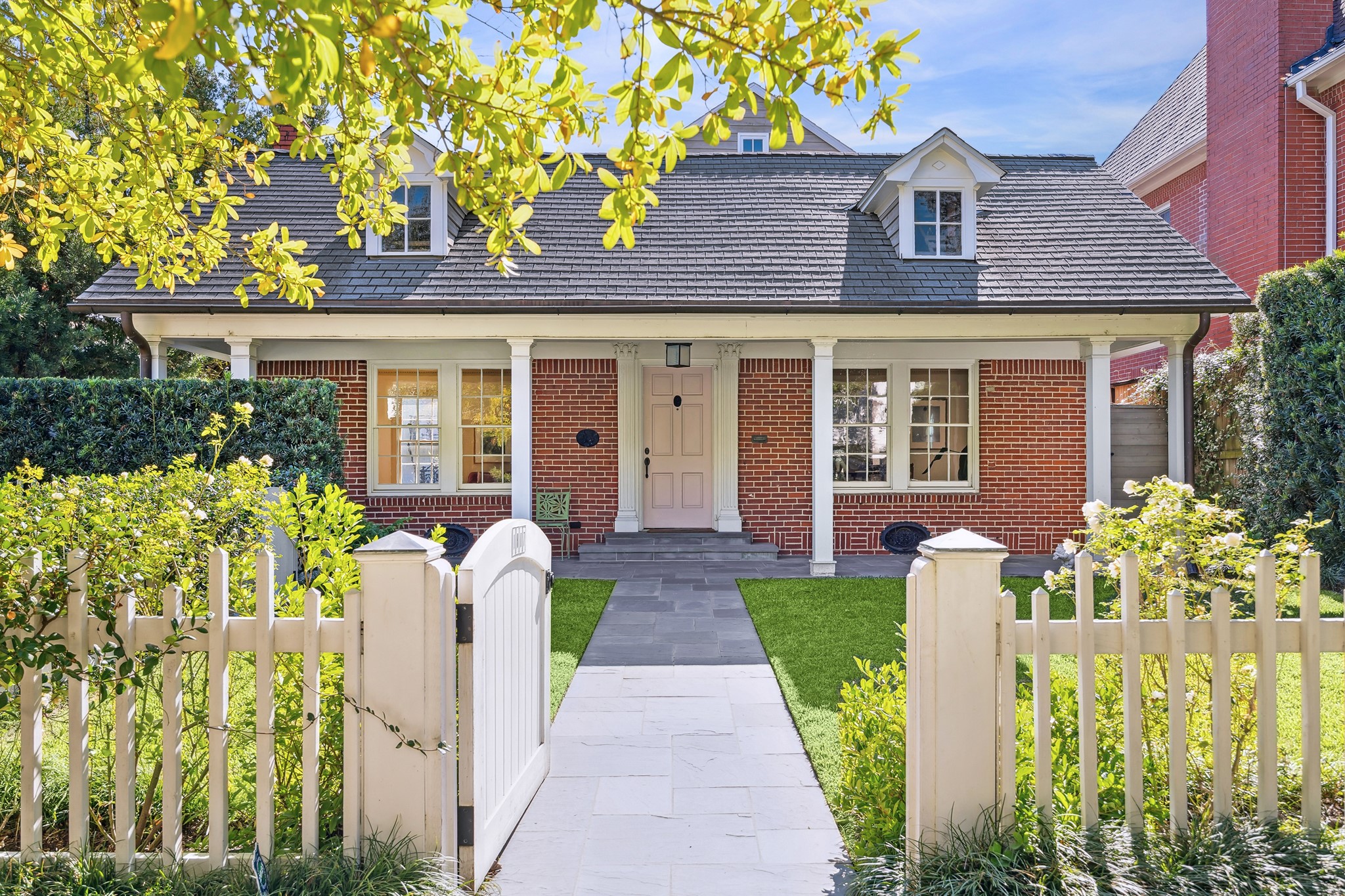 front view of a house with a garden