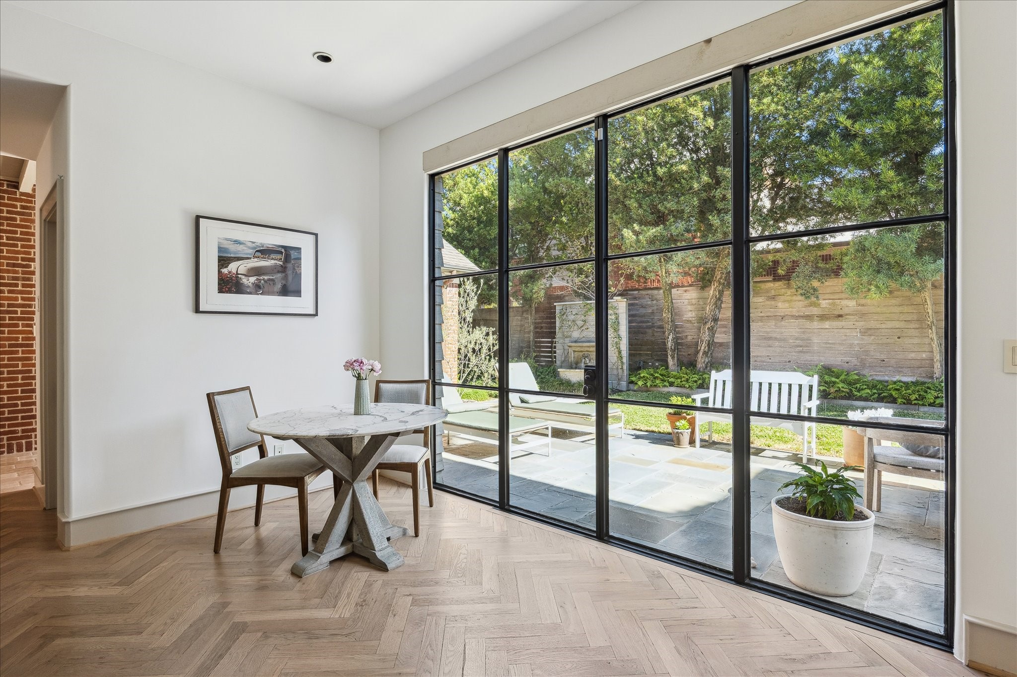 1807 Albans Road Houston, TX 77005 - Photo 16 of 39 a view of a dining room with furniture large windows and garden view