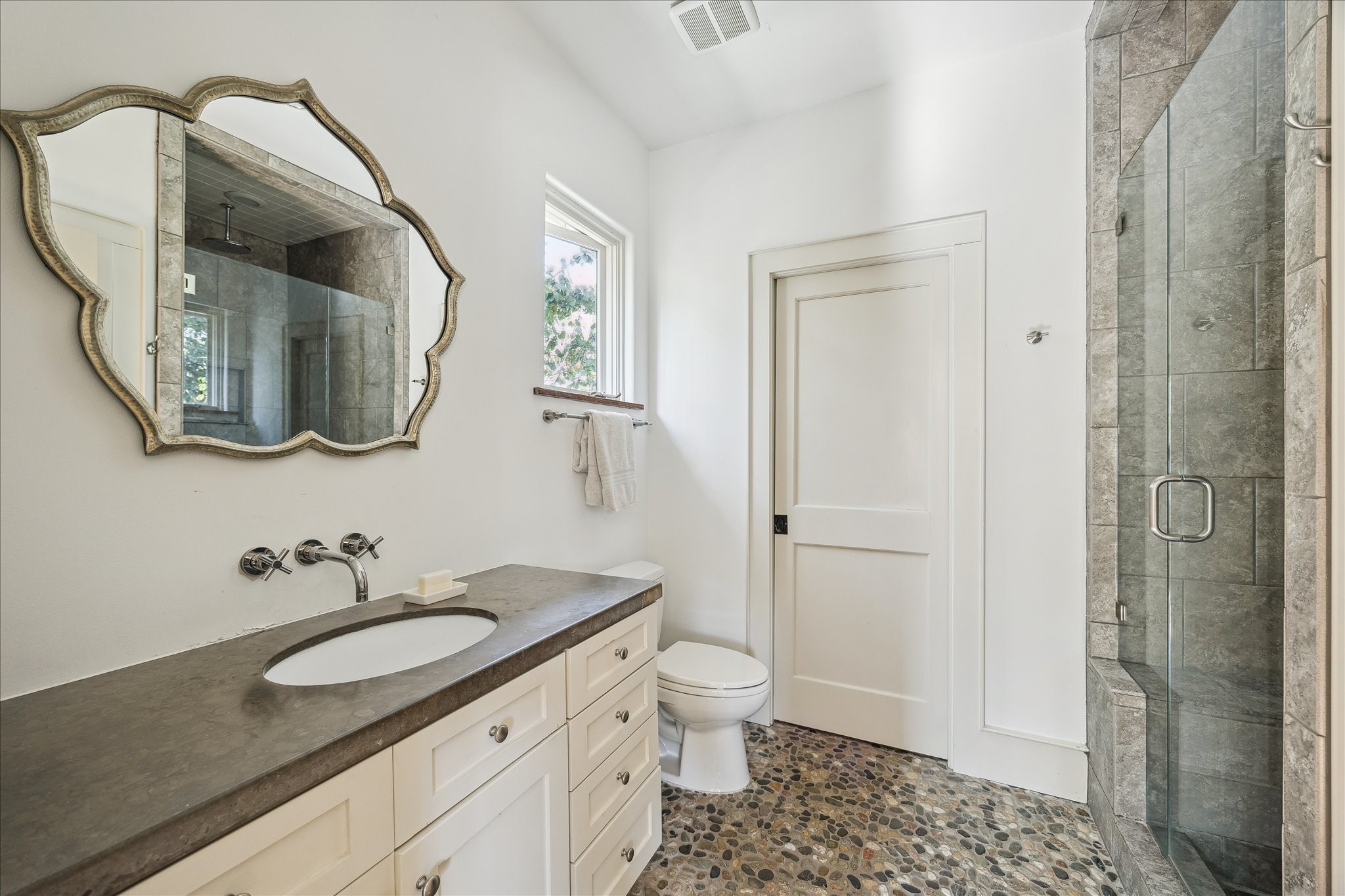 1807 Albans Road Houston, TX 77005 - Photo 23 of 39 a bathroom with a granite countertop sink a toilet and a mirror