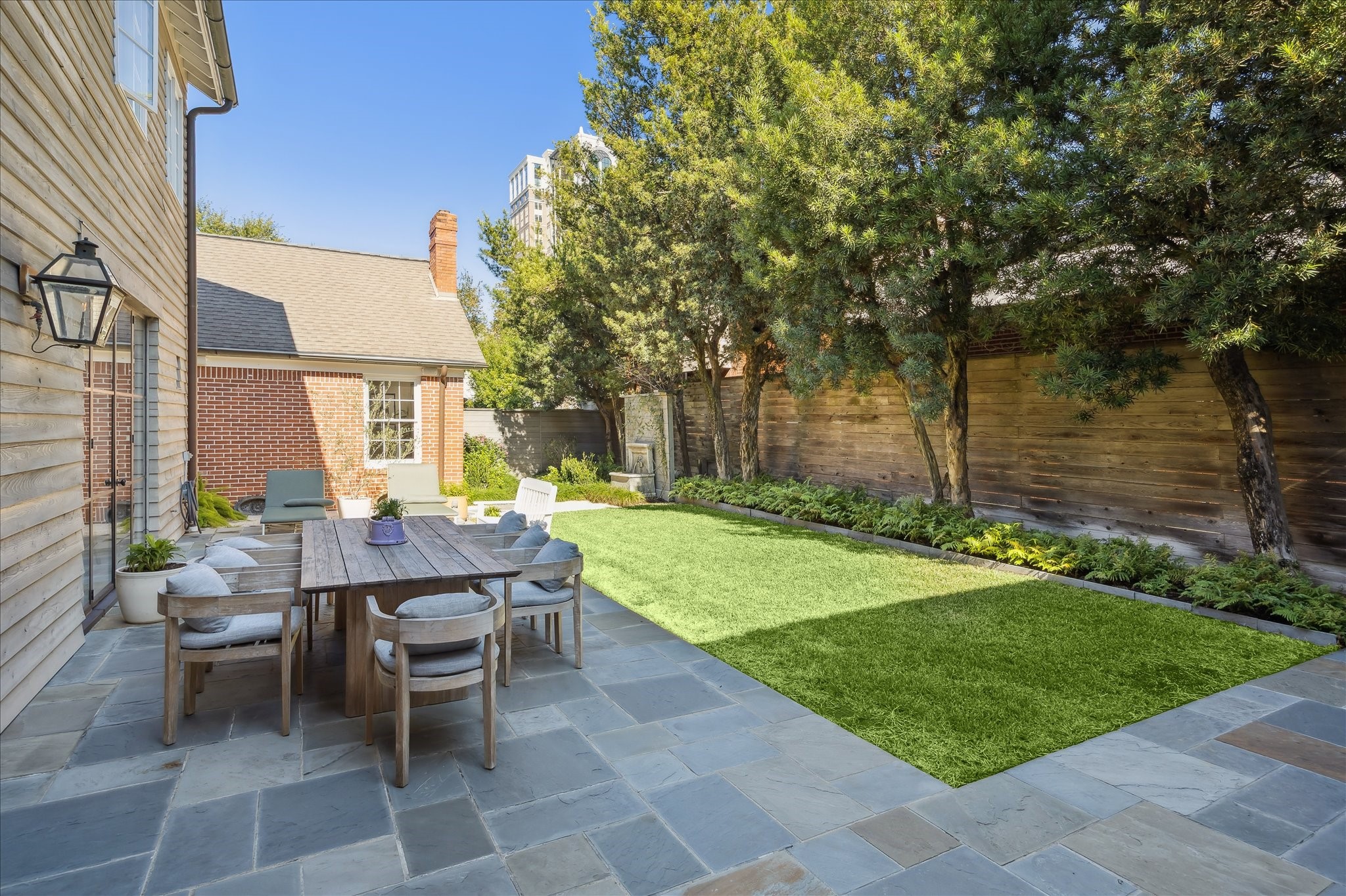 1807 Albans Road Houston, TX 77005 - Photo 27 of 39 a view of a patio with table and chairs and potted plants