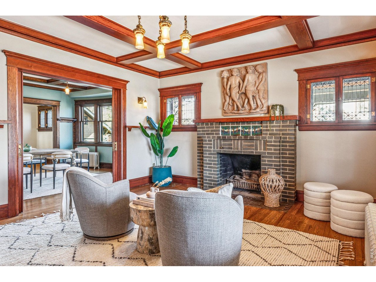 851 14th Street Boulder, CO 80302 - Photo 12 of 50 a living room with furniture a fireplace and potted plants