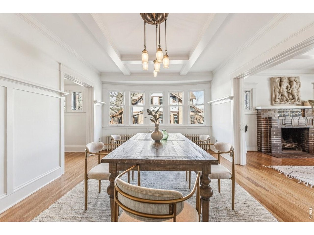 851 14th Street Boulder, CO 80302 - Photo 16 of 50 a view of a dining room with furniture a chandelier and wooden floor