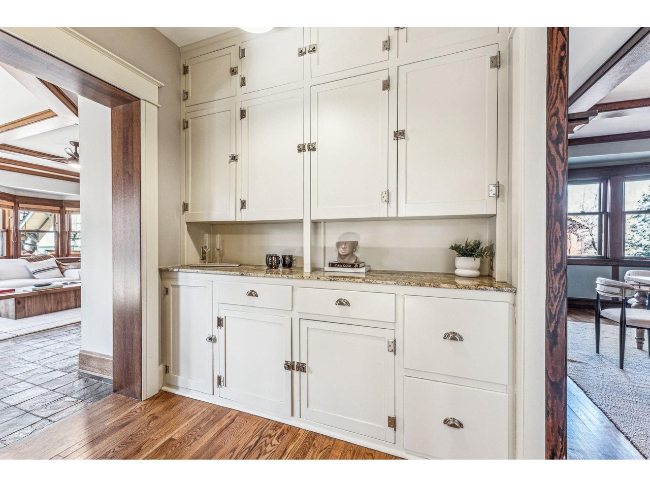 851 14th Street Boulder, CO 80302 - Photo 24 of 50 a kitchen with granite countertop white cabinets and white appliances