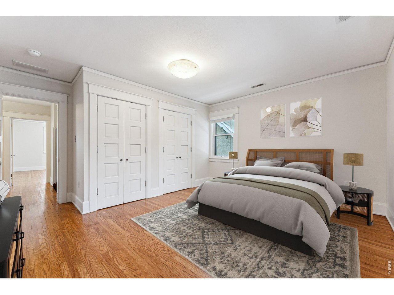 851 14th Street Boulder, CO 80302 - Photo 42 of 50 a bedroom with a bed and a painting on the wall