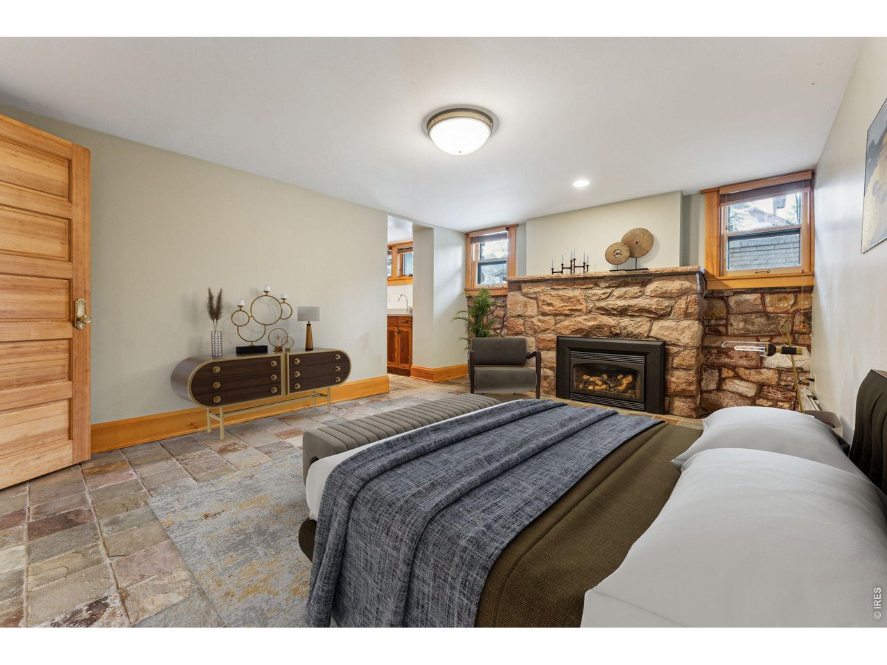 851 14th Street Boulder, CO 80302 - Photo 46 of 50 a bedroom with a large bed and a flat screen tv