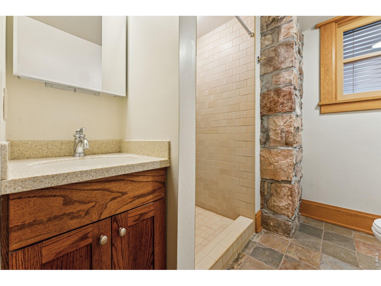 851 14th Street Boulder, CO 80302 - Photo 49 of 50 a bathroom with a sink a vanity and a shower