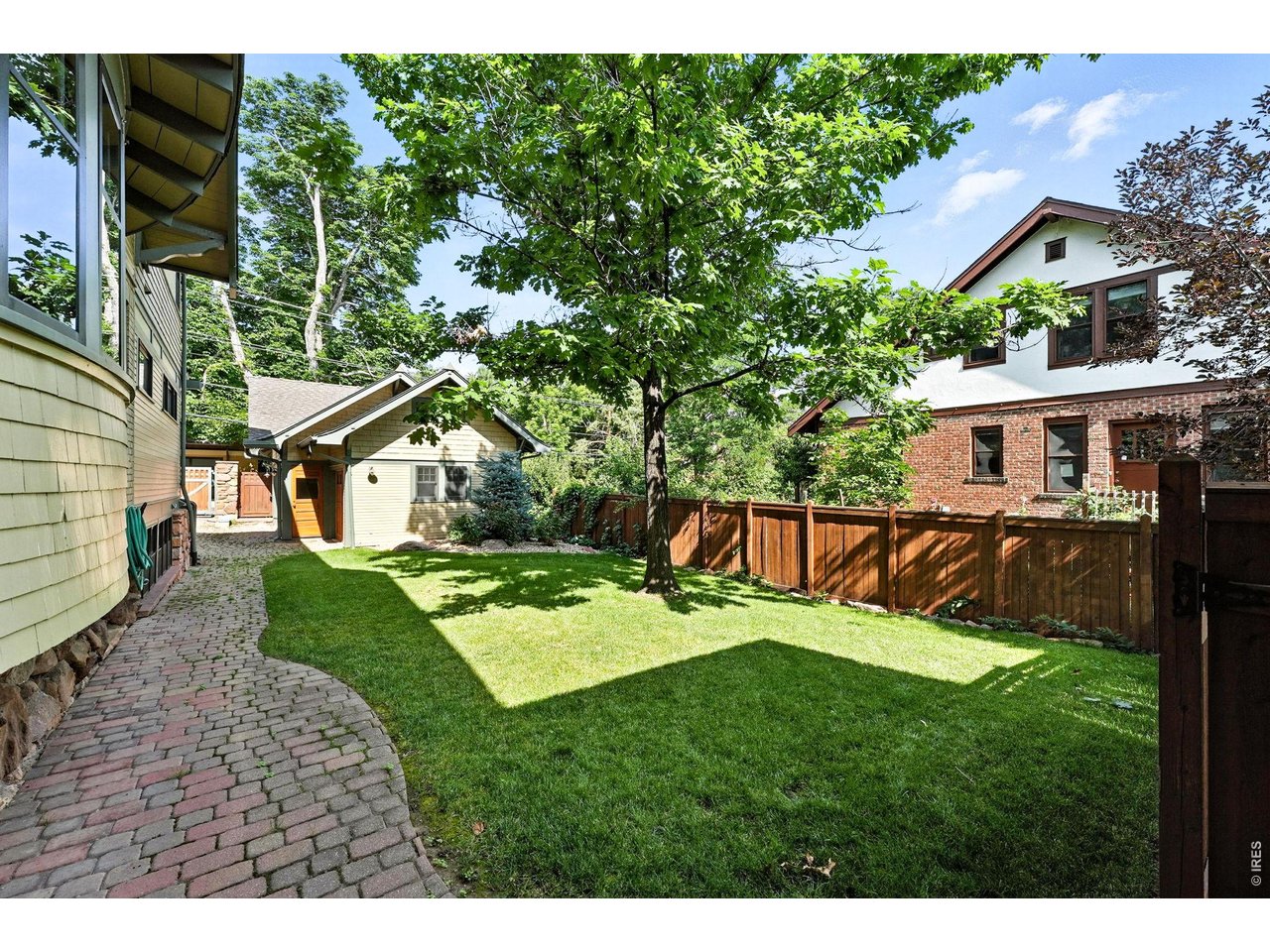 851 14th Street Boulder, CO 80302 - Photo 6 of 50 a view of a house with backyard sitting area and garden