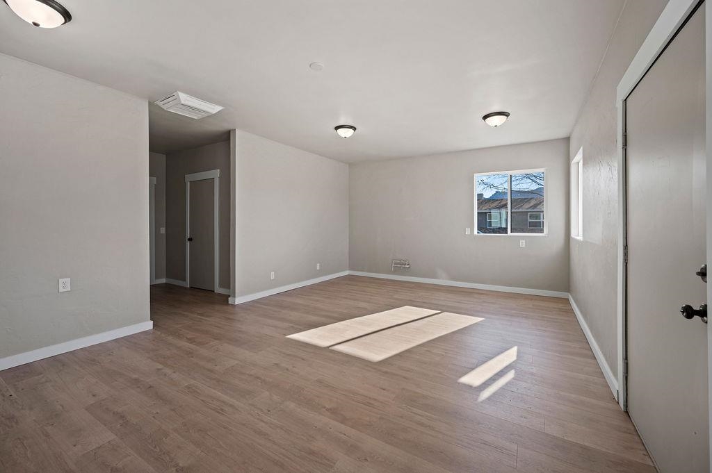508 Rosa Street Palisade, CO 81526 - Photo 12 of 18 wooden floor in an empty room with a window