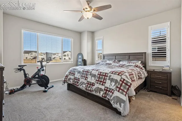 a bed room with a bed and a desk