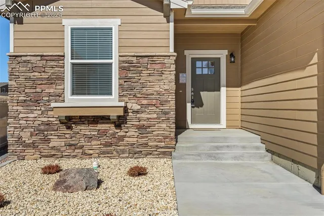 a side view of a house with a window