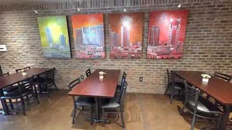 a view of a chairs and table in the patio