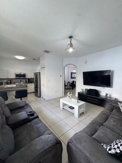 12923 Southwest 135th Terrace Miami, FL 33186 - Photo 11 of 71 a living room with furniture and a flat screen tv