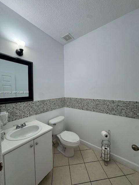 12923 Southwest 135th Terrace Miami, FL 33186 - Photo 18 of 71 a bathroom with a sink a toilet and a mirror