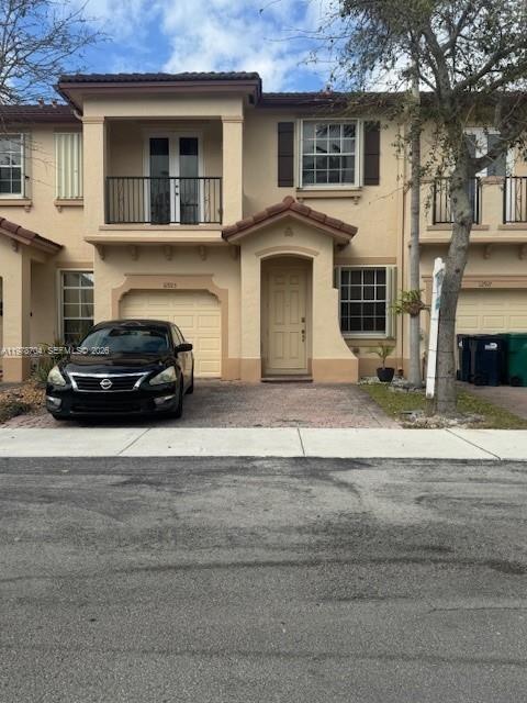 12923 Southwest 135th Terrace Miami, FL 33186 - Photo 2 of 71 a car parked in front of a house