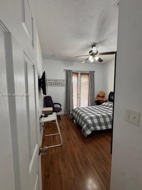12923 Southwest 135th Terrace Miami, FL 33186 - Photo 29 of 71 a bedroom with a bed and a chandelier