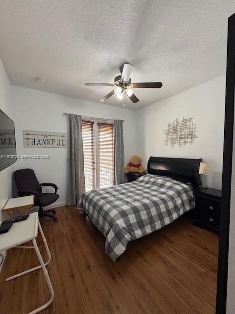 12923 Southwest 135th Terrace Miami, FL 33186 - Photo 30 of 71 a bedroom with a bed and a chandelier