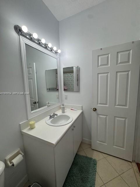 12923 Southwest 135th Terrace Miami, FL 33186 - Photo 37 of 71 a bathroom with a sink and a mirror