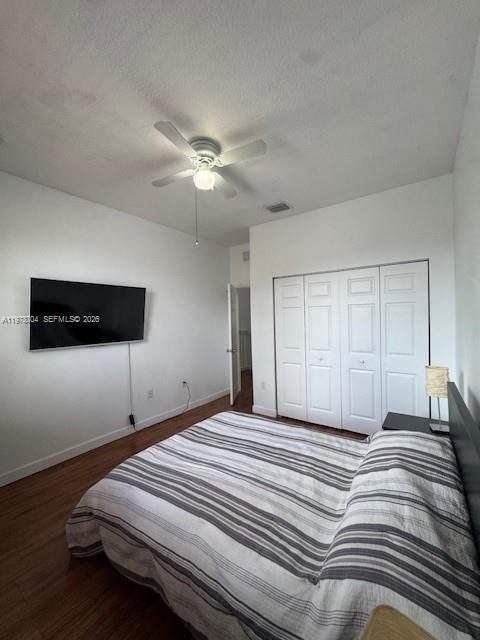 12923 Southwest 135th Terrace Miami, FL 33186 - Photo 40 of 71 a bedroom with a large bed and a ceiling fan