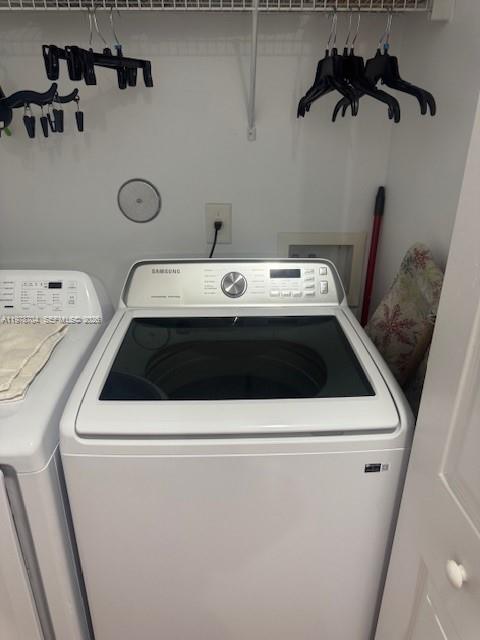 12923 Southwest 135th Terrace Miami, FL 33186 - Photo 46 of 71 a utility room with dryer and washer
