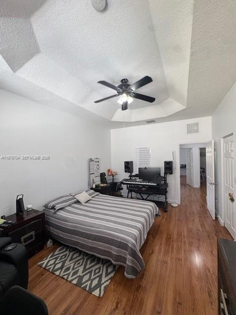 12923 Southwest 135th Terrace Miami, FL 33186 - Photo 48 of 71 a bed room with a bed and a ceiling fan