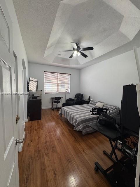 12923 Southwest 135th Terrace Miami, FL 33186 - Photo 50 of 71 a bedroom with a bed and wooden floor