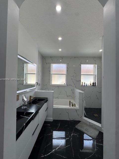 12923 Southwest 135th Terrace Miami, FL 33186 - Photo 57 of 71 a bathroom with a sink a toilet and bathtub