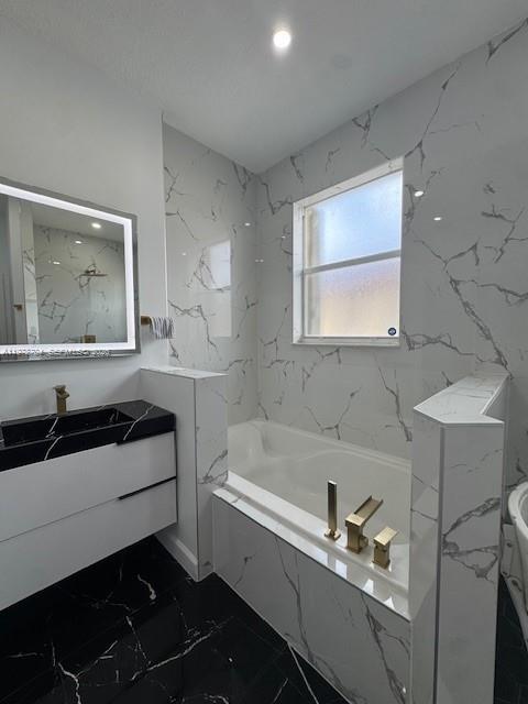 12923 Southwest 135th Terrace Miami, FL 33186 - Photo 58 of 71 a bathroom with a sink and a bathtub