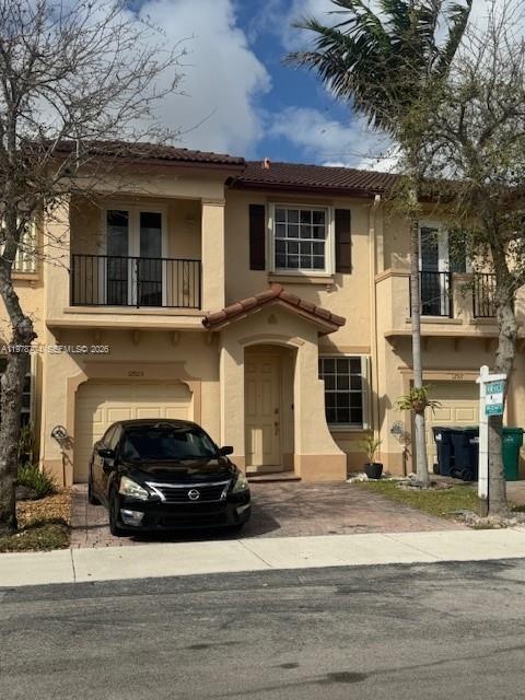 12923 Southwest 135th Terrace Miami, FL 33186 - Photo 6 of 71 a view of a car parked front of a house