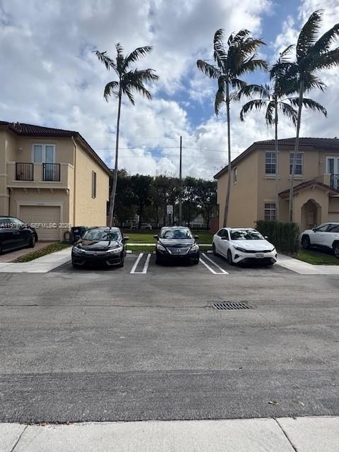 12923 Southwest 135th Terrace Miami, FL 33186 - Photo 68 of 71 a car parked on the side of the road