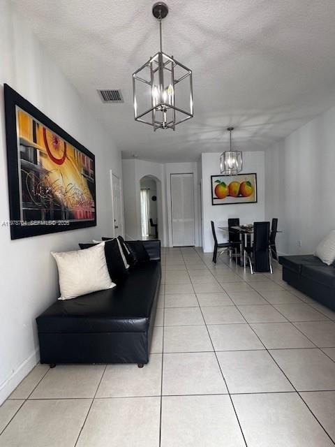 12923 Southwest 135th Terrace Miami, FL 33186 - Photo 7 of 71 a living room with furniture and a flat screen tv