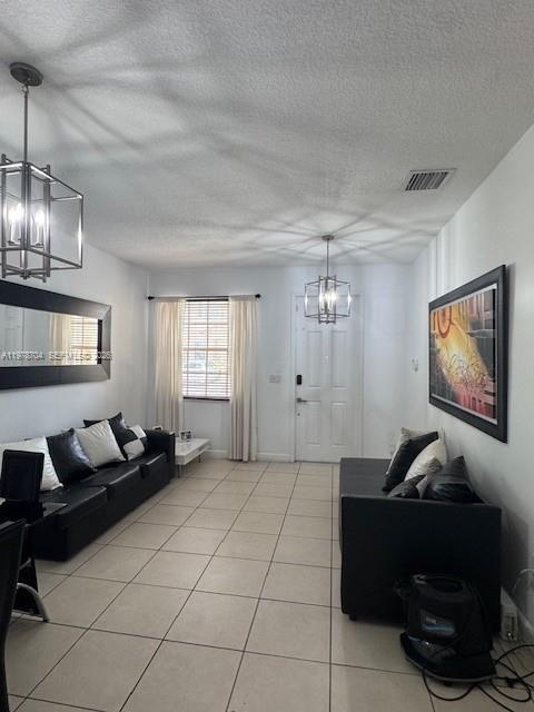 12923 Southwest 135th Terrace Miami, FL 33186 - Photo 8 of 71 a living room with furniture a dining table and a window