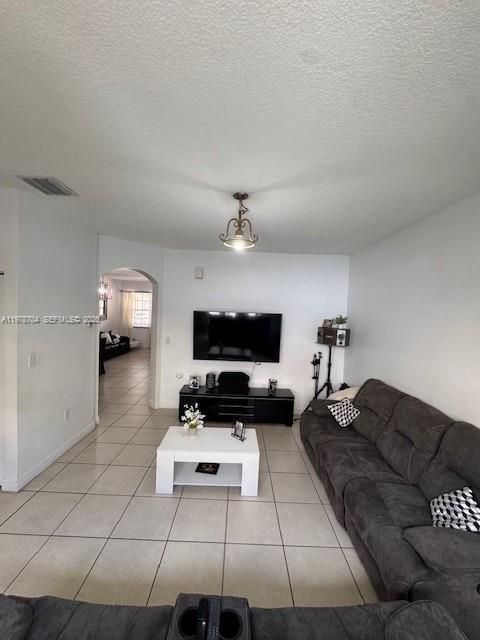 12923 Southwest 135th Terrace Miami, FL 33186 - Photo 10 of 71 a living room with furniture and a flat screen tv