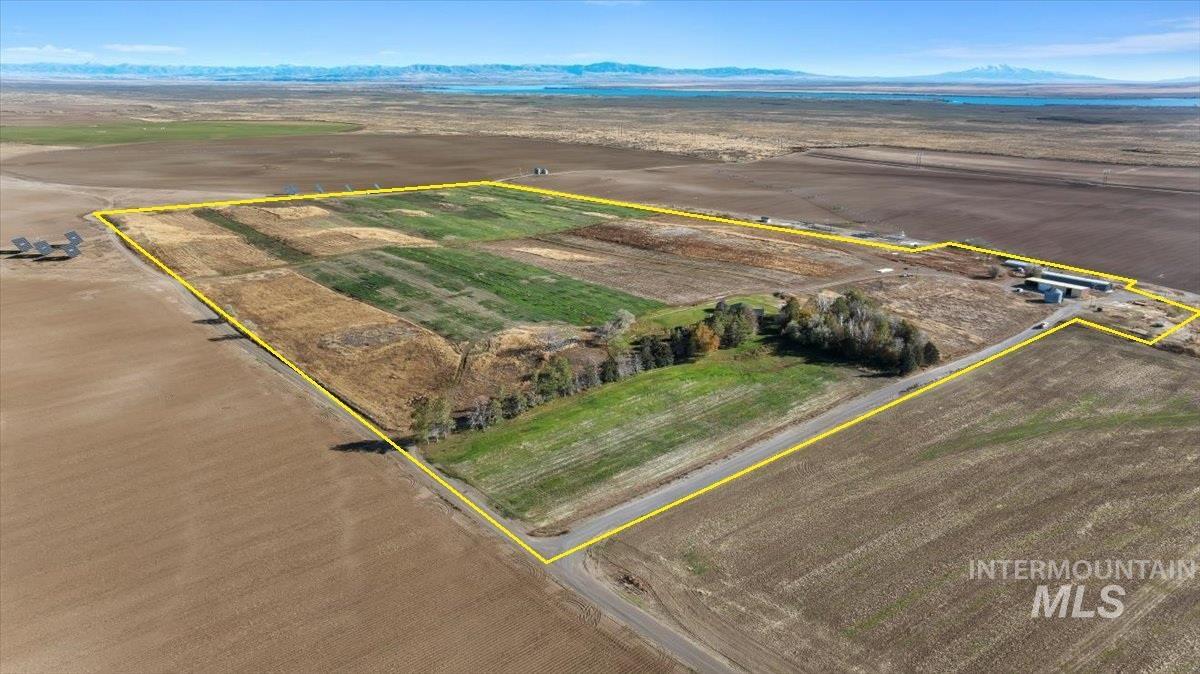 173 Main Line Ranch Road Rupert, ID 83350 - Photo 43 of 47 Aerial view of sparsely populated area featuring mountains, property boundaries highlighted, and large plots for crops