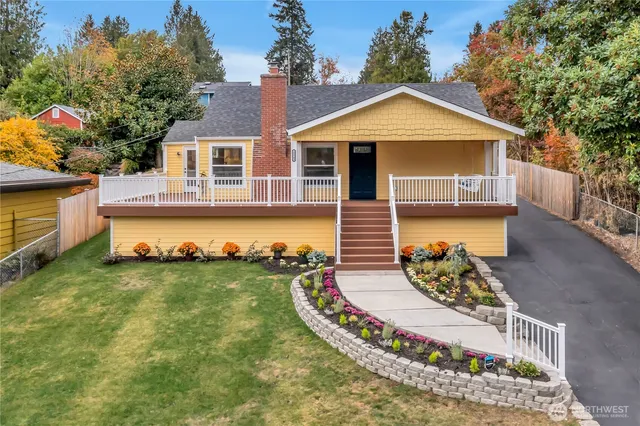 a front view of a house with a garden
