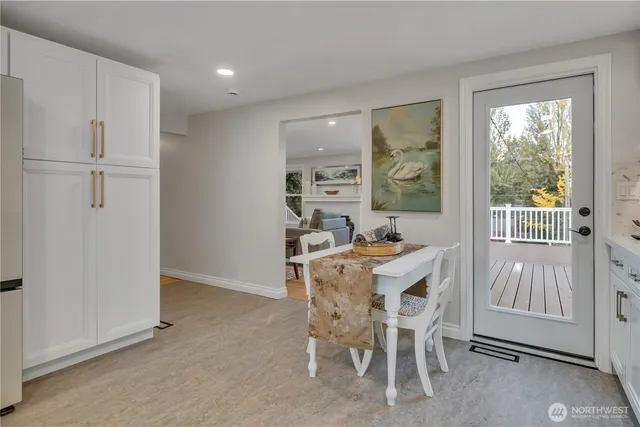 a view of a dining room with furniture window and outside view