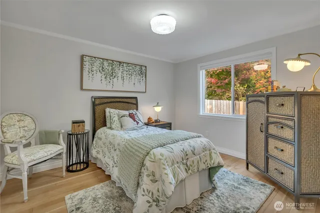 a bed room with a bed and a window