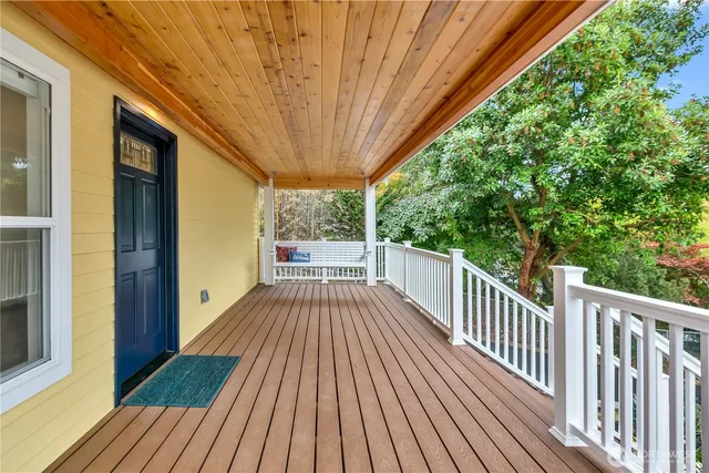 a view of balcony with wooden floor