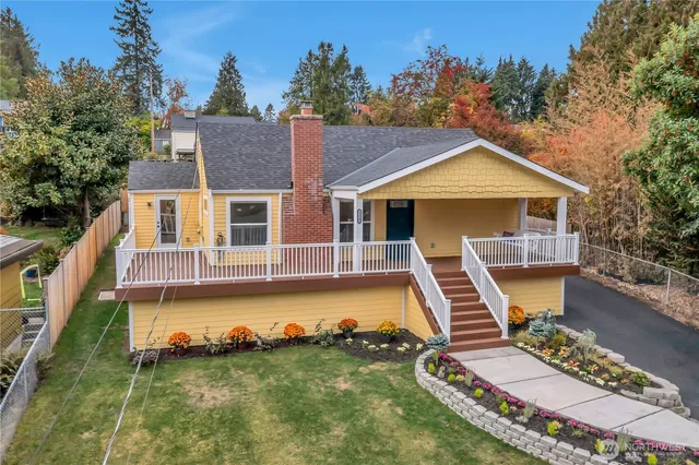 a front view of a house with a yard table and chairs