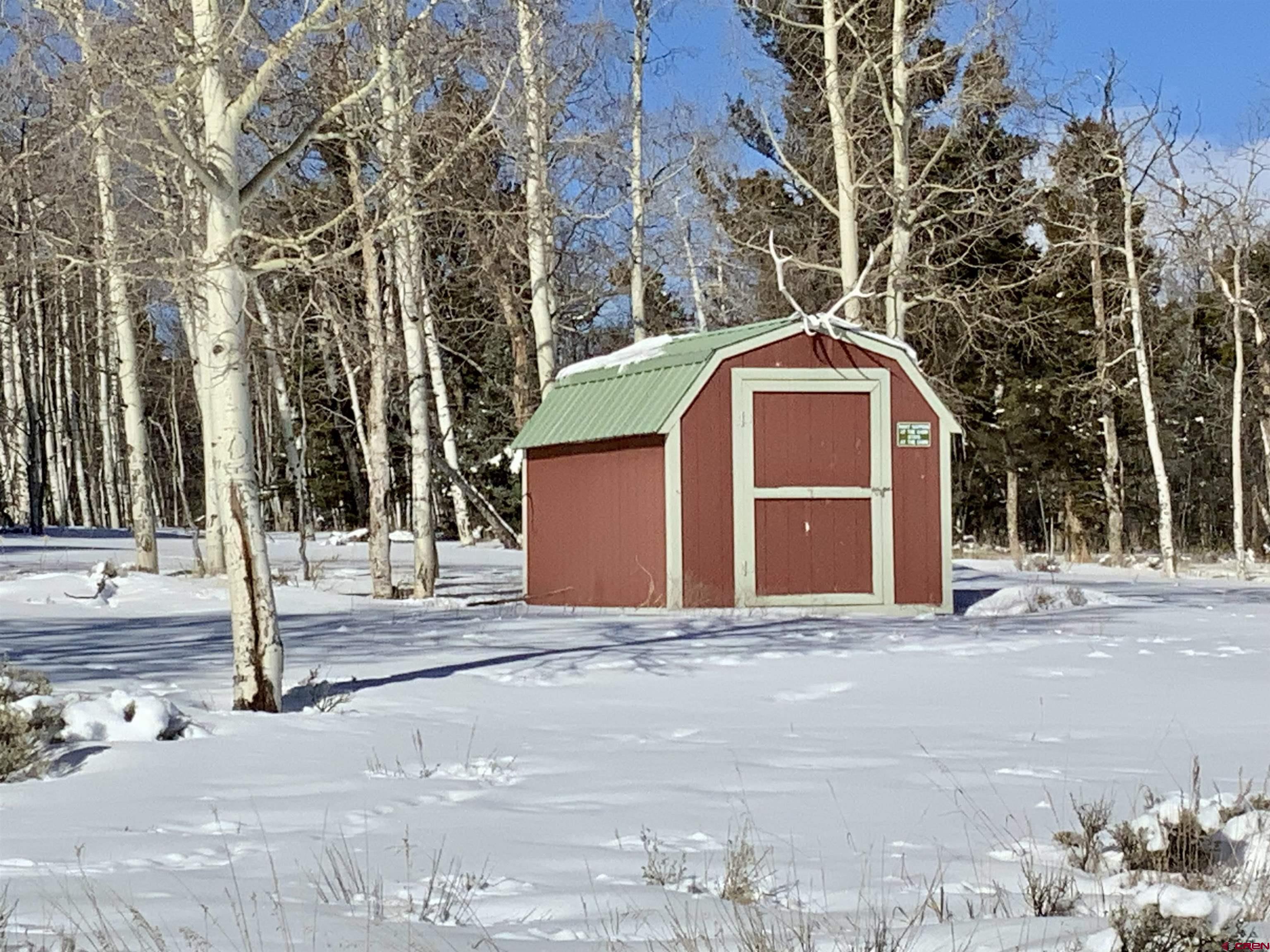1019 Uncompahgre Drive Powderhorn, CO 81243 - Photo 15 of 33 a front view of a house with a yard