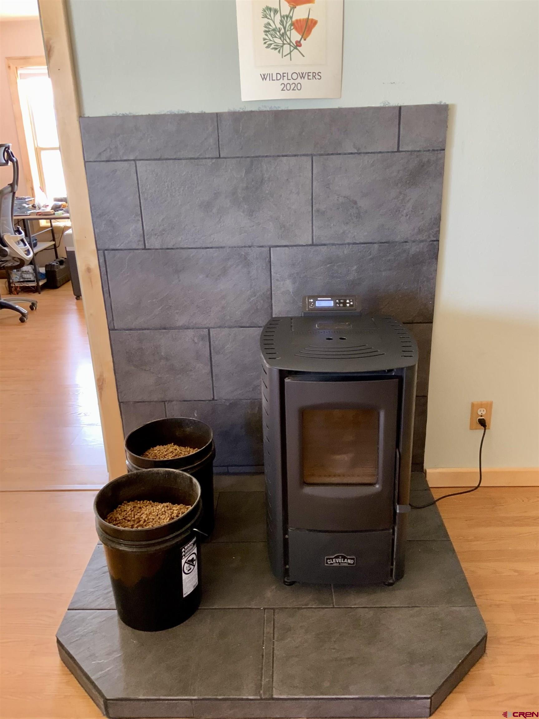 1019 Uncompahgre Drive Powderhorn, CO 81243 - Photo 18 of 33 a living room with a fireplace and a wooden floor