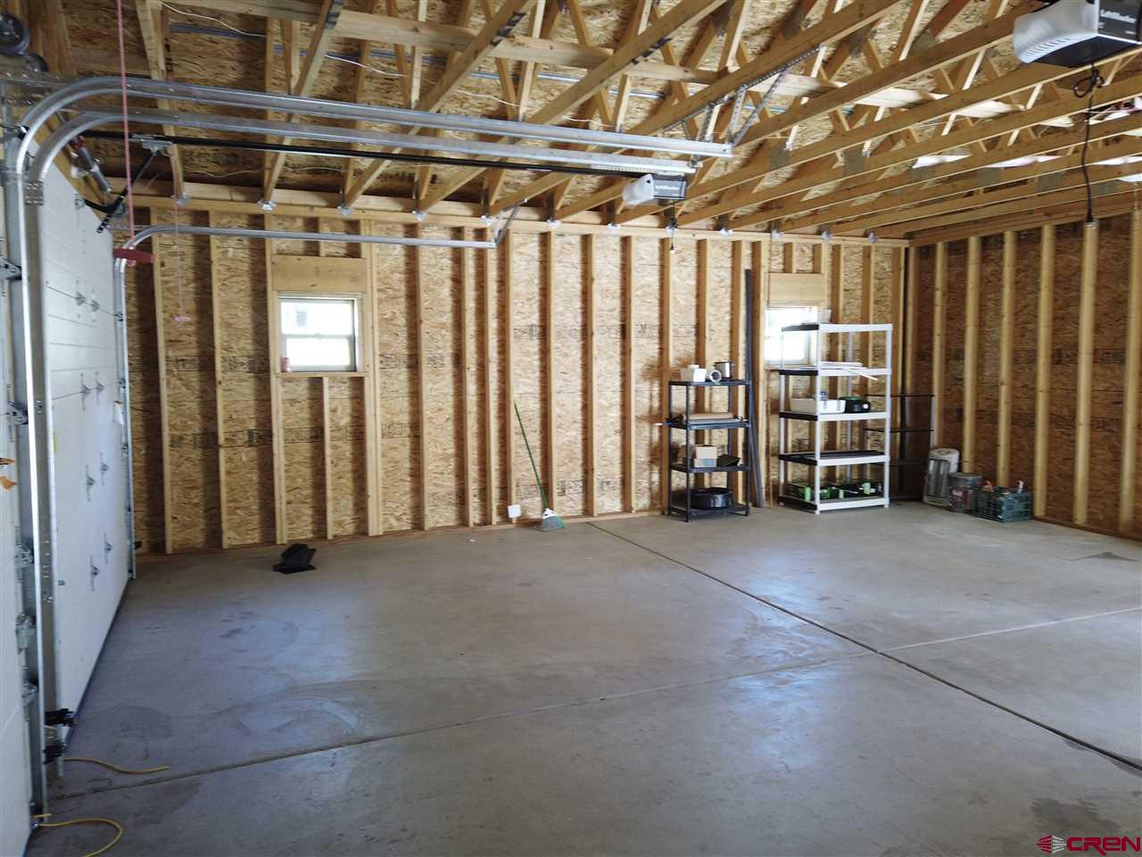 1019 Uncompahgre Drive Powderhorn, CO 81243 - Photo 26 of 33 a view of an empty room with stairs