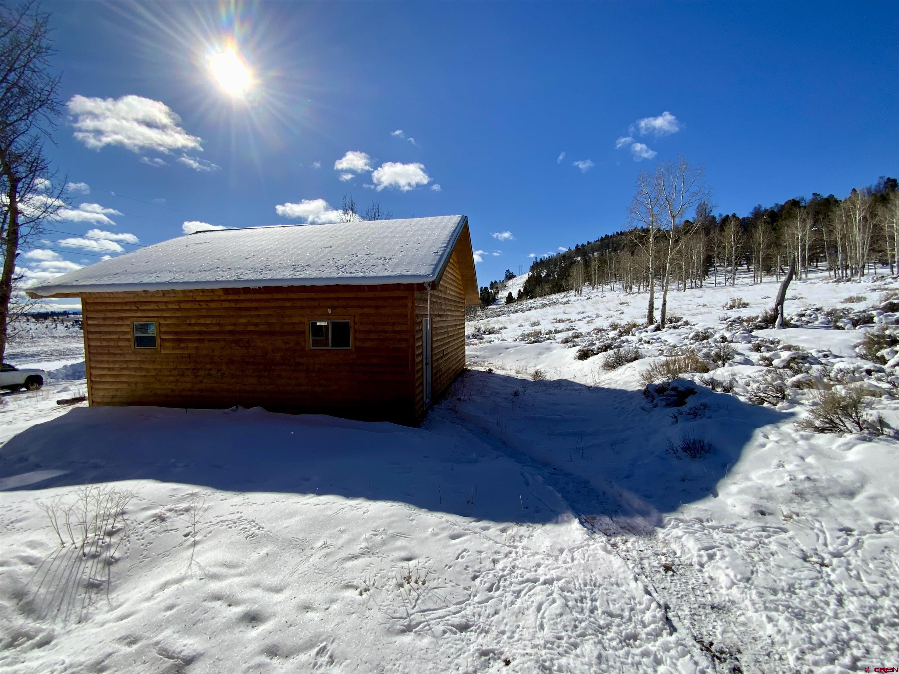 1019 Uncompahgre Drive Powderhorn, CO 81243 - Photo 3 of 33 a view of a yard with wooden fence