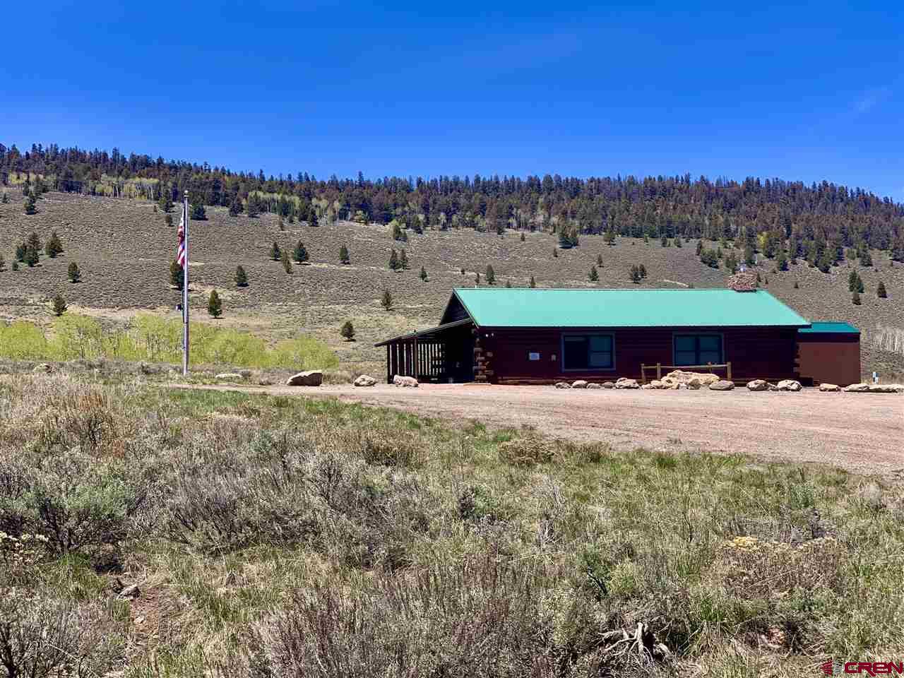 1019 Uncompahgre Drive Powderhorn, CO 81243 - Photo 31 of 33 a aerial view of a house with a yard