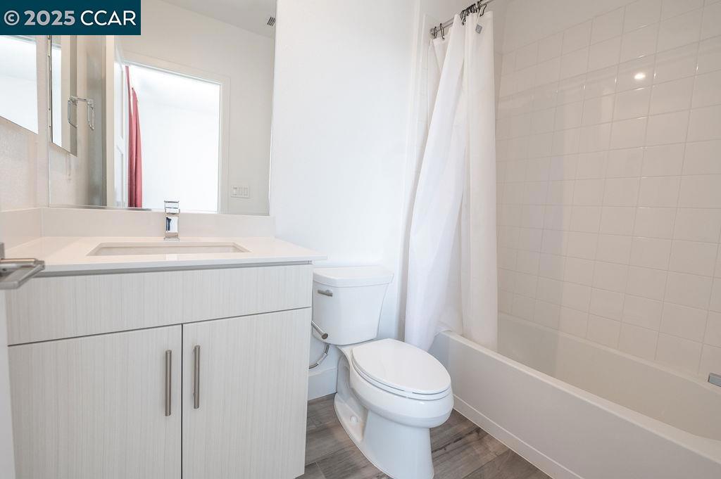 9877 MacArthur Boulevard Oakland, CA 94605 - Photo 5 of 13 a bathroom with a sink a toilet and shower