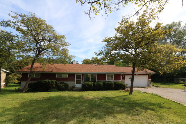 211 Old Elm Road Joliet, IL 60433 - Photo 1 of 12 a front view of a house with a yard and trees