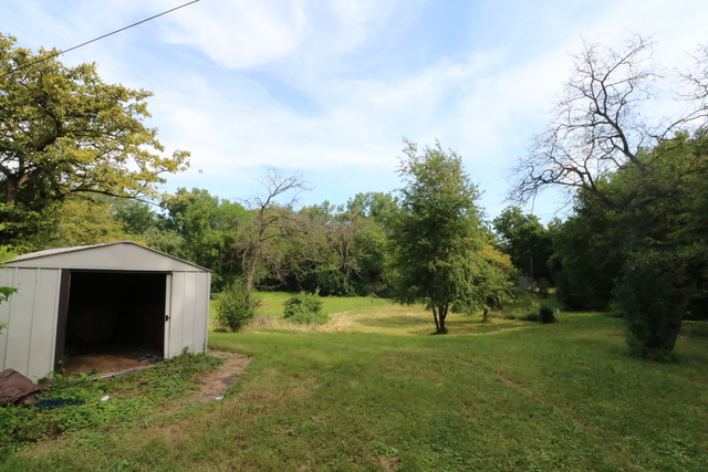 211 Old Elm Road Joliet, IL 60433 - Photo 11 of 12 a view of green field with trees in the background