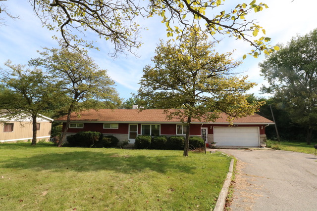211 Old Elm Road Joliet, IL 60433 - Photo 12 of 12 a front view of a house with a garden