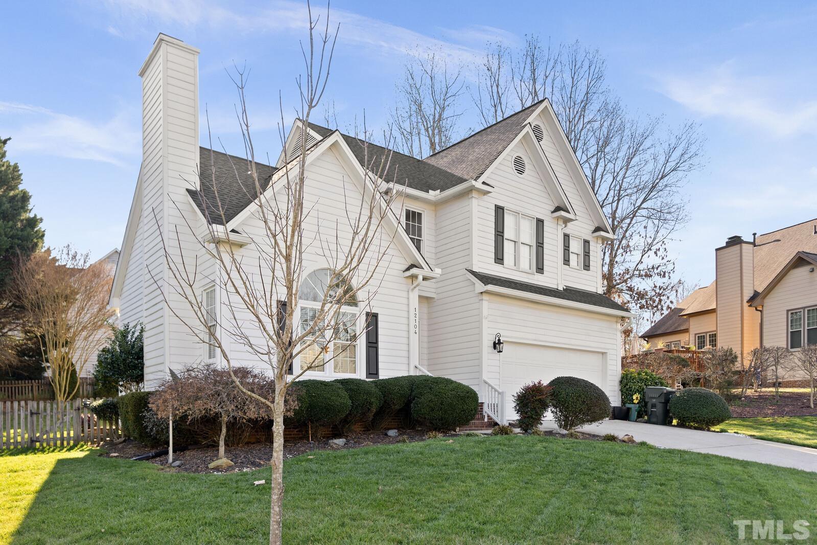 12104 Amoretto Way Raleigh, NC 27613 - Photo 2 of 21 a view of a front of house with a yard